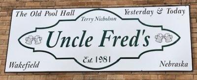 white background and black lettering stating Uncle Fred's was established in 1981